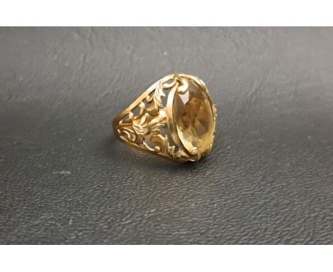 CITRINE SET DRESS RINGthe oval cut citrine measuring approximately 14.9mm x 10.5mm x 5mm, on nine carat gold shank with decor