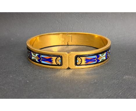 ENAMEL DECORATED BALLERINA CLASP BANGLE BY FREY WILLEthe enamel with Egyptian style decoration in twenty-four carat gold plat