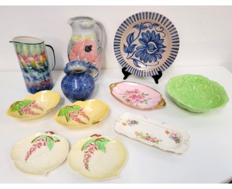 ELLE OF NORWAY POTTERY CHARGERThe edge decorated with blue and with flower to the centre, signed 'Elle 141b', 29cm diameter; 