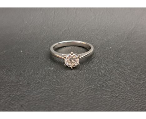DIAMOND SOLITAIRE RINGthe round brilliant cut diamond measuring 1.01cts, on fourteen carat white gold shank, ring size P and 