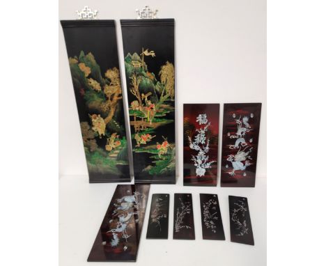 SELECTION OF VINTAGE ORIENTAL LACQURED PANELSthe largest pair depicting colourful scene of men climbing and falling down a mo