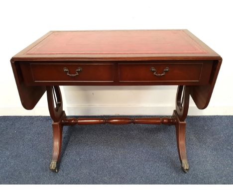 MAHOGANY SOFA TABLEwith tooled red leather inserts to the top and side flaps, with two drawers and two opposing dummy drawers