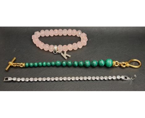 THREE FASHION JEWELLERY BRACELETScomprising a Missoma graduated malachite bead bracelet with eighteen carat gold plated clasp