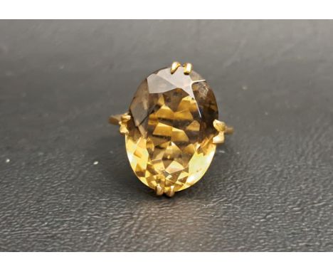 SMOKY QUARTZ SINGLE STONE DRESS RINGthe quartz measuring approximately 17mm x 12.8mm x 7.4mm, on nine carat gold shank, ring 