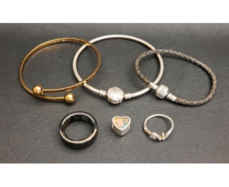 SELECTION OF FASHION JEWELLERYcomprising a bangle with Sparkling Snowflake clasp, a Pandora black leather bracelet, a Pandora