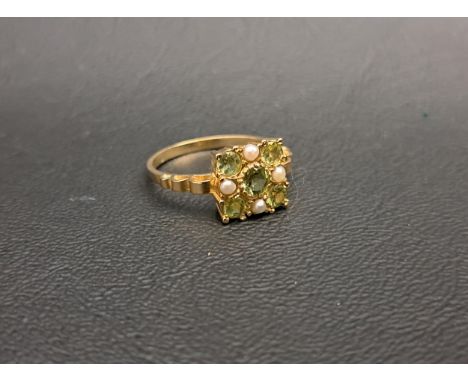 PERIDOT AND SEED PEARL CLUSTER RINGthe five peridots and four seed pearls in square setting, on nine carat gold shank, ring s