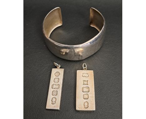 THREE PIECES OF SILVER JEWELLERYcomprising two silver ingot pendants, one hallmarked Birmingham 1977 the other Sheffield 1977