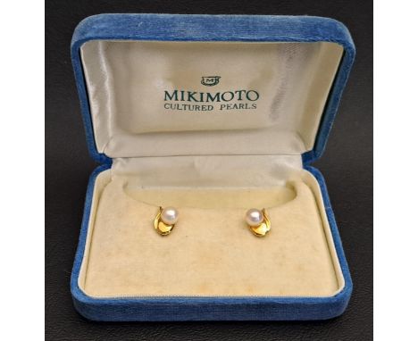 PAIR OF MIKIMOTO PEARL STUD EARRINGSthe single pearl on each earring on stylised teardrop shaped mount, in eighteen carat gol