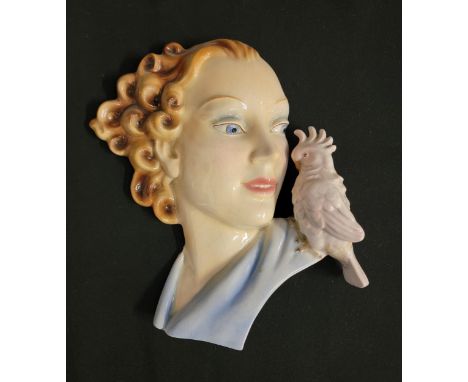 ART DECO GOEBEL POTTERY WALL MASKdepicting a curly haired lady in profile with a parrot on her shoulder, with incised mark to