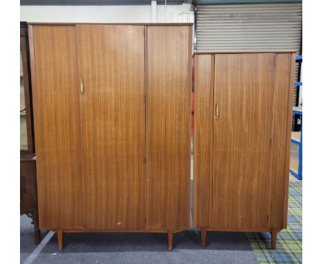 TWO LEBUS MID CENTURY WARDROBESthe largest wardrobe with two rails and raised on tapered legs, 123 x 183 x 46cm, the smaller 