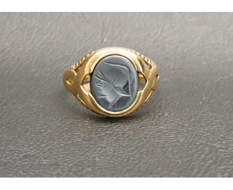 HARDSTONE SEAL RINGthe matrix depicting a stylised profile of a man in a hat, on nine carat gold shank with decorative pierce