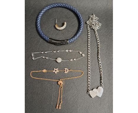 SELECTION OF FASHION JEWELLERYcomprising a Tate Ossian plaited leather bracelet, a Guess heart decorated necklace, a Swarovsk