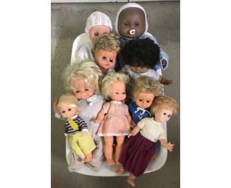 9 vintage vinyl dolls. Large and medium sizes. All in outfits. 