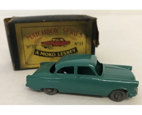 A boxed Matchbox #33 Ford Zodiac in teal green. Model mint condition, box fair - staining &amp; slight tear. Grey plastic whe