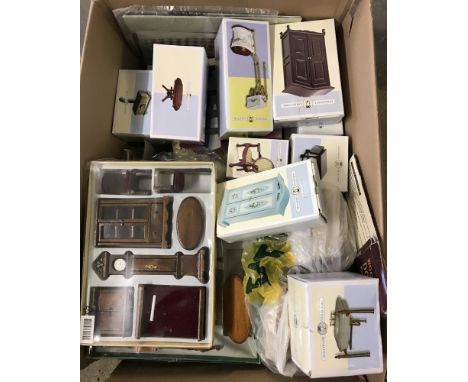 A large quantity of mainly boxed wooden and ceramic dolls house furniture.  