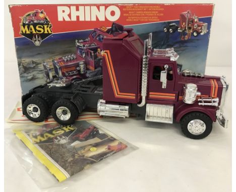 A boxed 1985 Kenner Parker Toys "Mask" Rhino Toy. Mask Tractor Rig/Mobile Defence unit, with 3 action figures, Bruce Sato &am