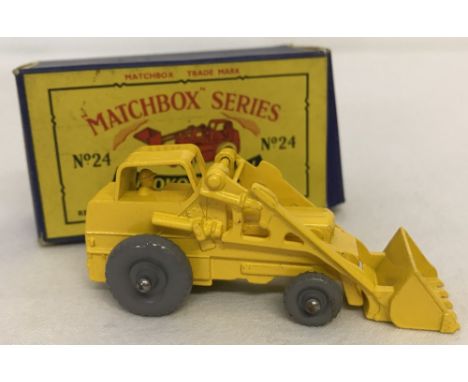 A boxed Matchbox #24 Weatherill Hydraulic Excavator. Model mint condition, box excellent. Grey plastic wheel version. 