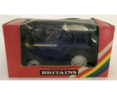 A boxed Britains #9523 Ford TW-20 Tractor. With driver, 1:32 scale. 