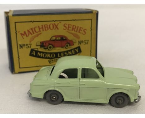 A boxed Matchbox #57 Wolseley 1500 in pale green. Model mint condition, box excellent. Grey plastic wheel version. 