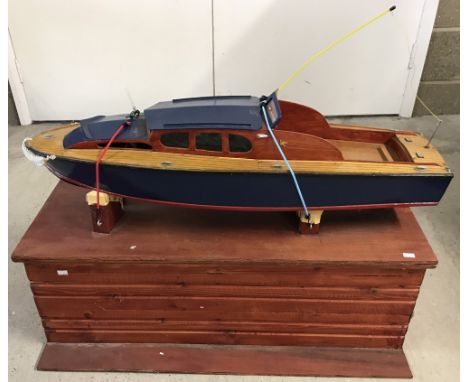 Scratch built model wooden speed boat with storage box. With approx 2cc glow plug engine, and an Irvine hand fuel pump. conta