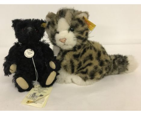 A miniature Steiff Black 1912 Teddy Bear together with a Steiff cat. Yellow labels. EAN 29257 &amp; EAN 77395. Bear is black 