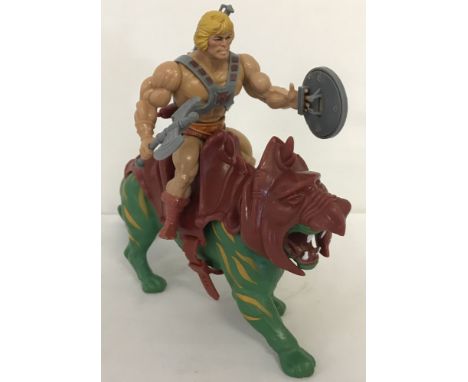 A vintage Mattel 1981 Masters of the Universe He-Man &amp; Battle Cat action figures. Complete with Battle Cat's body and hea