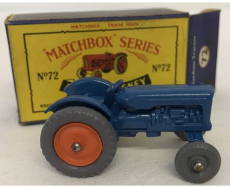 A boxed Matchbox #72 Fordson Tractor with dark orange wheel rims. Model mint condition, box good - some staining. Grey plasti