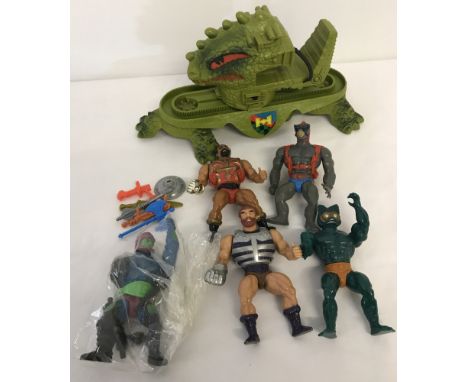 A box of assorted 1980's Mattel Masters of the Universe action figures and playset. To include: Dragon Walker Assault vehicle