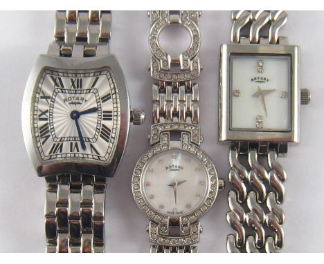 Rotary. A lot comprising three Lady's Rotary stainless steel wrist watches. Quartz movement. One with a tonneau case, one wit