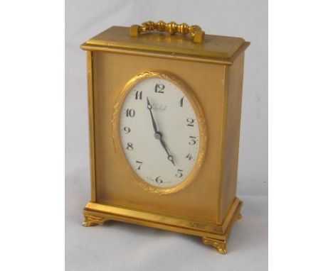 A gilt metal Imhof mantel clock, dial signed Imhof, Swiss IS jewel lever escapement, clock approx. 11cm high.