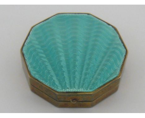 A decagonal silver gilt Houbigant powder compact , the lid with turquoise sunburst engine turned enamel, Birmingham 1929. 
