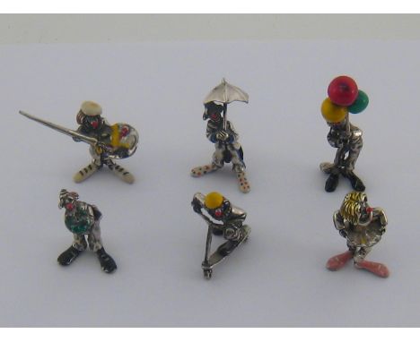 A group of six modern Italian silver and enamel miniature figures of clowns, including one with bunch of balloons, one riding