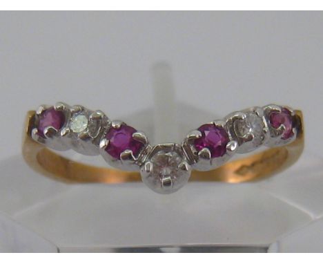 A 9 carat gold ruby and diamond “wishbone” ring, size O, 1.8 gms.
