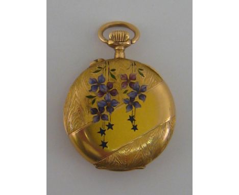 A 14k gold and enamel fob watch. The back of the case imitating wood grain and depicting a floral motif with stars. White ena