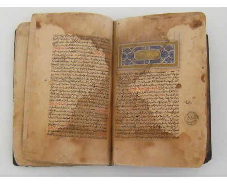 An early full leather bound volume in Arabic manuscript. 