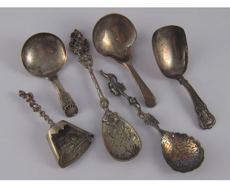 A Georgian silver caddy spoon, Thomas Wallis, London, 1805, another two, both Joseph Taylor, Birmingham 1825, and three cast 