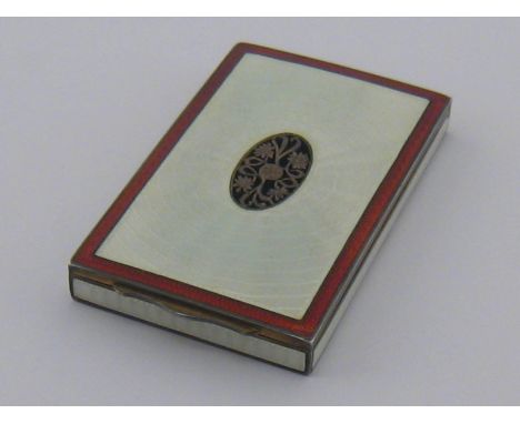 An Austrian silver gilt lady's cigarette case with perforated oval grille in the engine turned oyster white enamel lid. Vienn