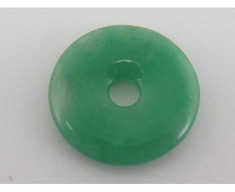 A Chinese jade disc pendant, approx 22mm diameter.
