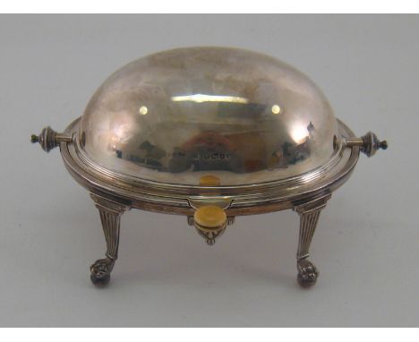 A Victorian silver butter dish with swing over cover on reeded legs with claw and ball feet by William Hutton and Sons, Londo