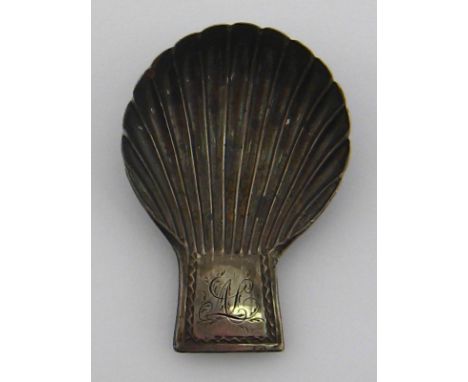 A Georgian early Sheffield silver shell caddy spoon with lug handle by Young, Greaves and Hoyland, Sheffield, 1781 ( date let