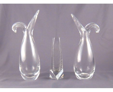 A pair of Steuben clear glass vases, each formed as an opening bulb, the bases signed “Steuben”. Ht.26cm., together with a Cz