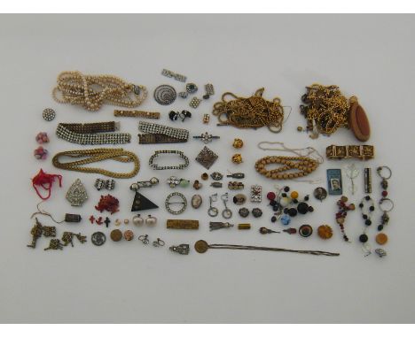 A large mixed lot of costume jewellery including gilt metal and gold plated jewellery, vintage diamante, an enamel bangle, fa