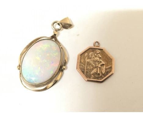 A 9carat gold St Christopher and a 9ct gold pendent set with an opal. Weight 4.5g