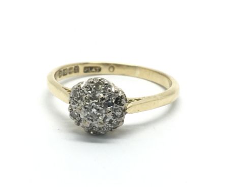 An 19ct gold diamond cluster ring in the form of a flowerhead, approx 3.3g and approx size M-N.