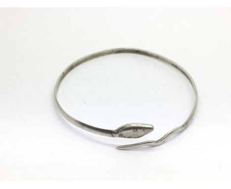 A silver snake bangle.