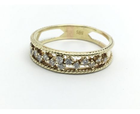 A 14ct gold half eternity open work diamond ring, approx 2.8g and approx size P-Q.