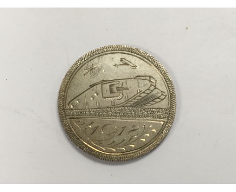 Trench art. A 1913 half crown engraved to the reverse with a WW1 tank and dated 1918.