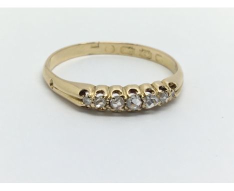 An 18ct gold seven stone diamond ring, approx 1.8g and approx size P.