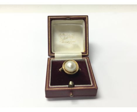 An 18carat gold ring set with a good size pearl. Ring size N-M.