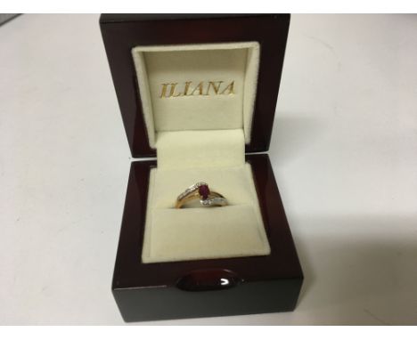 An 18carat yellow gold ring set with a ruby and small diamonds with a shaped double line shank ring size N-O